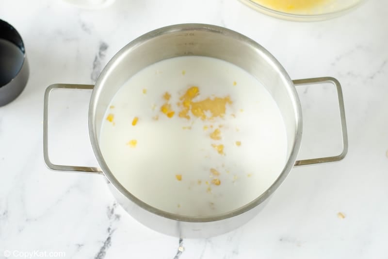 cream corn and milk in a pan