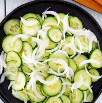 overhead view of cucumber onion salad in a bowl