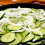 cucumber onion salad and wood salad server