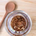 overhead view of homemade taco seasoning in a spice jar