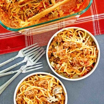 spaghetti casserole in a baking dish and two bowls