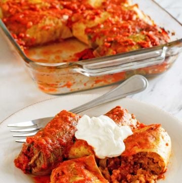 stuffed cabbage rolls in a baking dish and on a plate