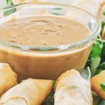 Thai peanut sauce in a bowl and spring rolls