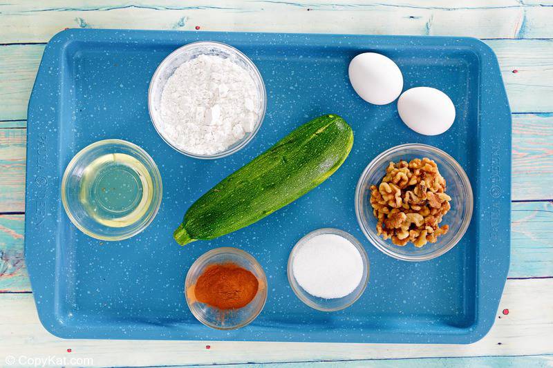zucchini cake ingredients on a tray