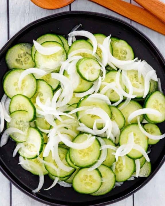 overhead view of cucumber onion salad in a bowl