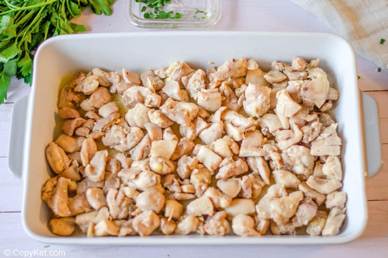 cooked chicken pieces in a baking dish.