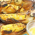 four ears of grilled corn on the cob
