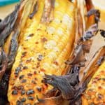 grilled corn on the cob on parchment paper
