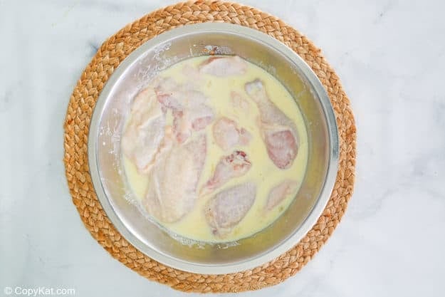 chicken pieces soaking in buttermilk