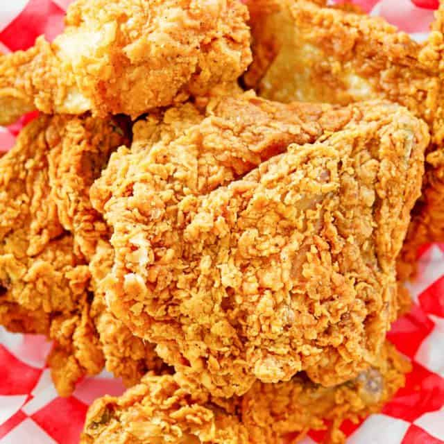 overhead view of homemade KFC fried chicken on parchment paper