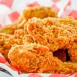 homemade KFC fried chicken in a parchment paper lined serving basket