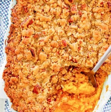 overhead view of sweet potato souffle with pecans in a baking dish.