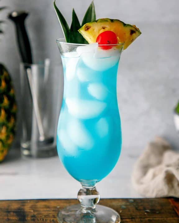 a homemade Olive Garden Blue Hawaiian cocktail in a hurricane glass