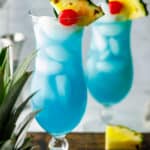 two glasses of homemade Olive Garden Blue Hawaiian drinks