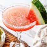 homemade Olive Garden watermelon cocktail garnished with a watermelon slice