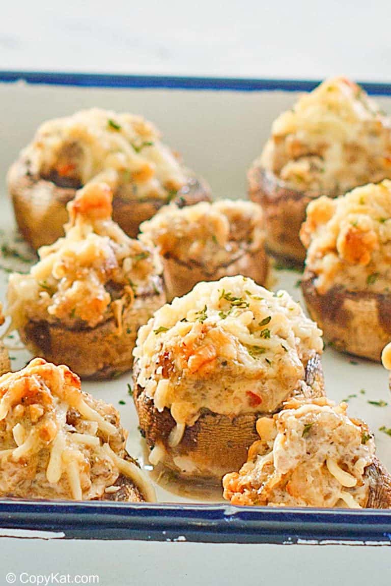 sausage stuffed mushrooms on a serving tray.