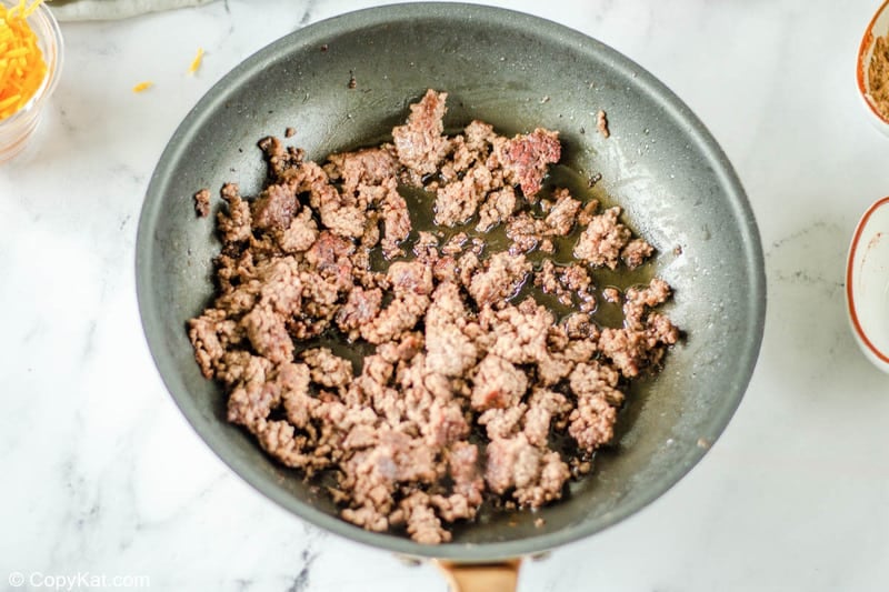 browned ground beef crumbles in a skillet