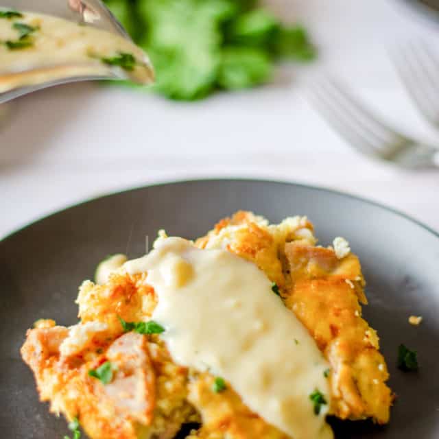 a serving of tarragon chicken casserole with sauce on a plate.