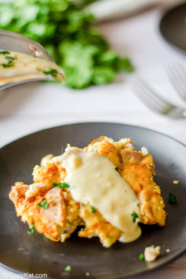 a serving of tarragon chicken casserole with sauce on a plate.