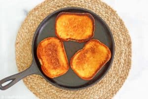 butter toasted Texas toast slices in a skillet