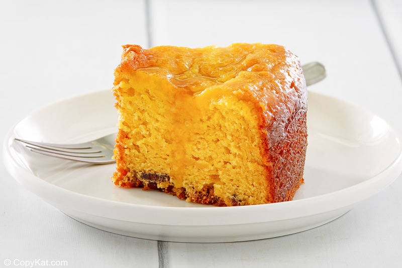 Bacardi rum cake slice and a fork on a plate.