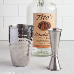 bottle of vodka, cocktail shaker, and jigger