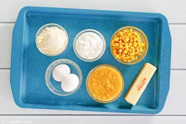 creamed corn casserole ingredients on a tray