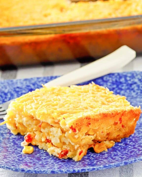 creamed corn casserole in a baking dish and on a plate