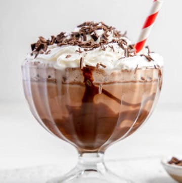 Frozen hot chocolate topped with whipped cream and chocolate shavings.