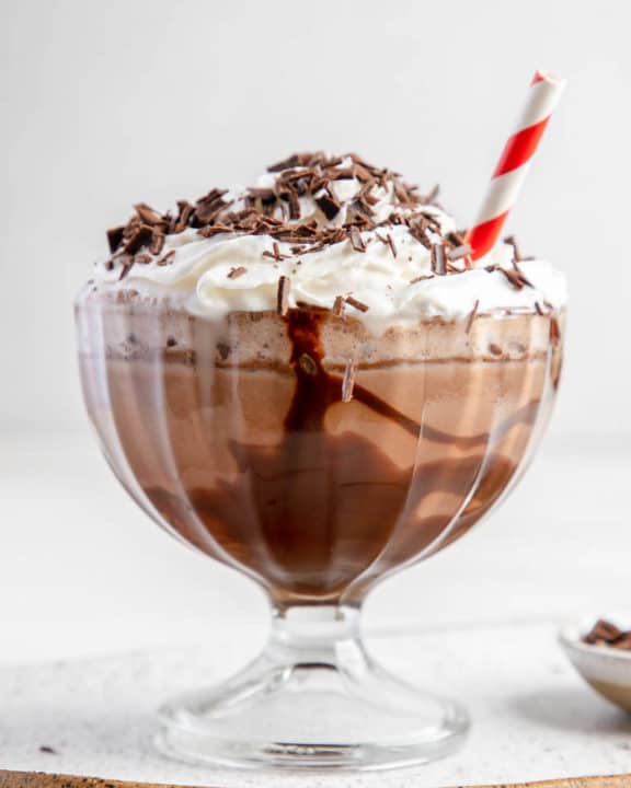 Frozen hot chocolate topped with whipped cream and chocolate shavings.