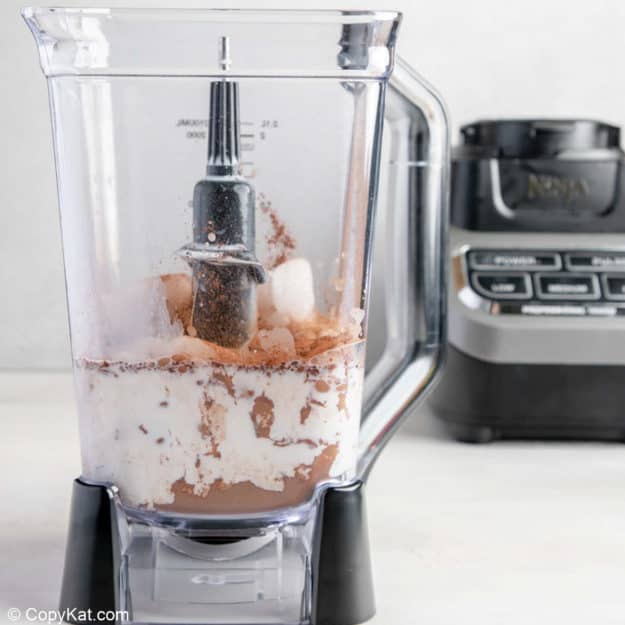 hot chocolate mix, ice, and milk in a blender.