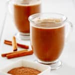 Mexican coffee in glass mugs and cinnamon sticks