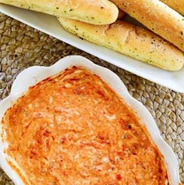 overhead view of homemade Olive Garden San Remo Seafood Dip and Breadsticks.