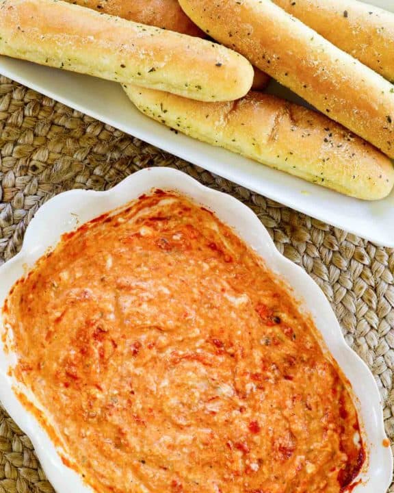 overhead view of homemade Olive Garden San Remo Seafood Dip and Breadsticks.
