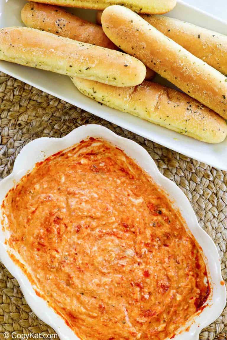 overhead view of homemade Olive Garden San Remo Seafood Dip and Breadsticks.