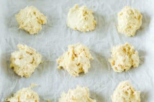 pineapple cookie dough balls on parchment paper