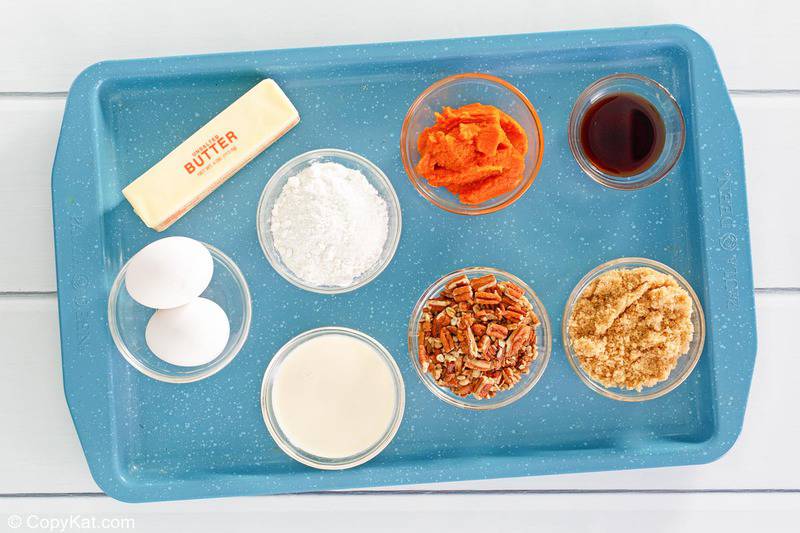 pumpkin dump cake ingredients on a tray