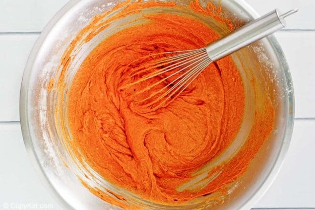 pumpkin muffins batter in a mixing bowl