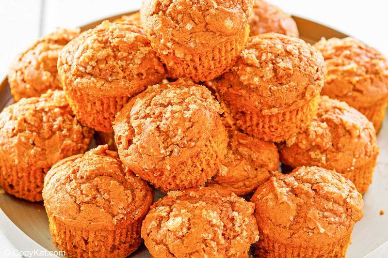 a stack of pumpkin muffins on a round tray