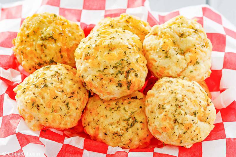 homemade Red Lobster Cheddar Bay Biscuits in a parchment paper lined bread basket