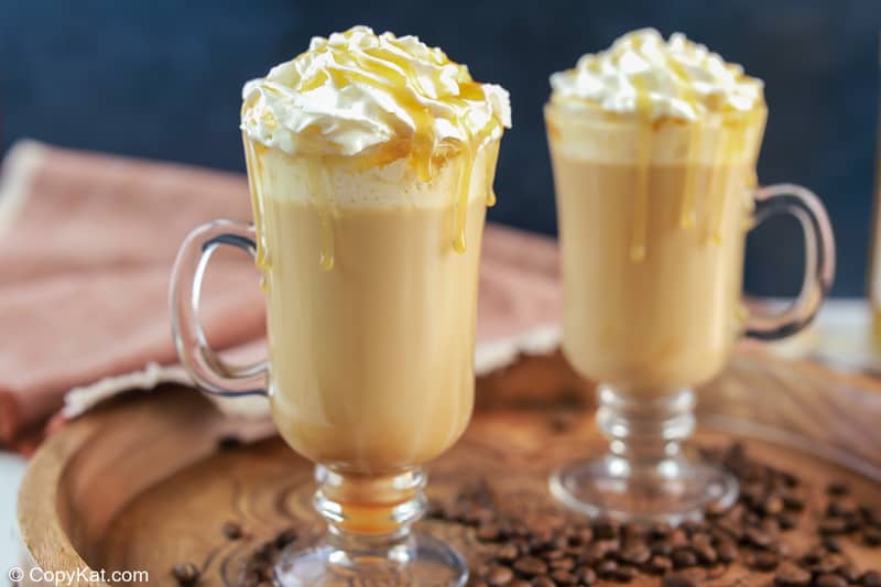 two homemade Starbucks caramel macchiato drinks on a tray