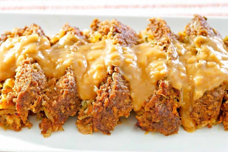 slices of stuffed meatloaf with gravy on top