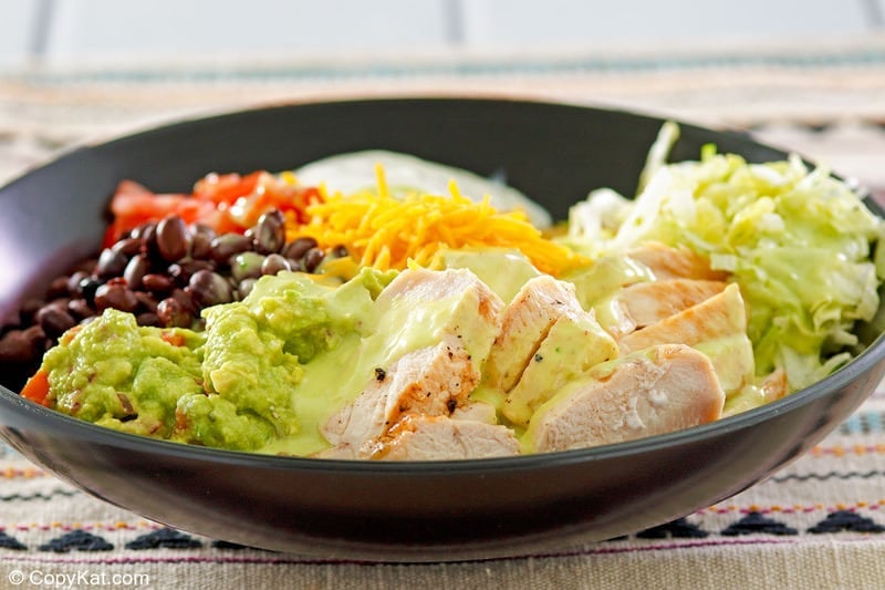 homemade Taco Bell power bowl with chicken in a black bowl