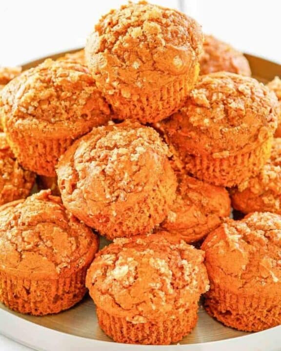 a pile of pumpkin muffins on a tray