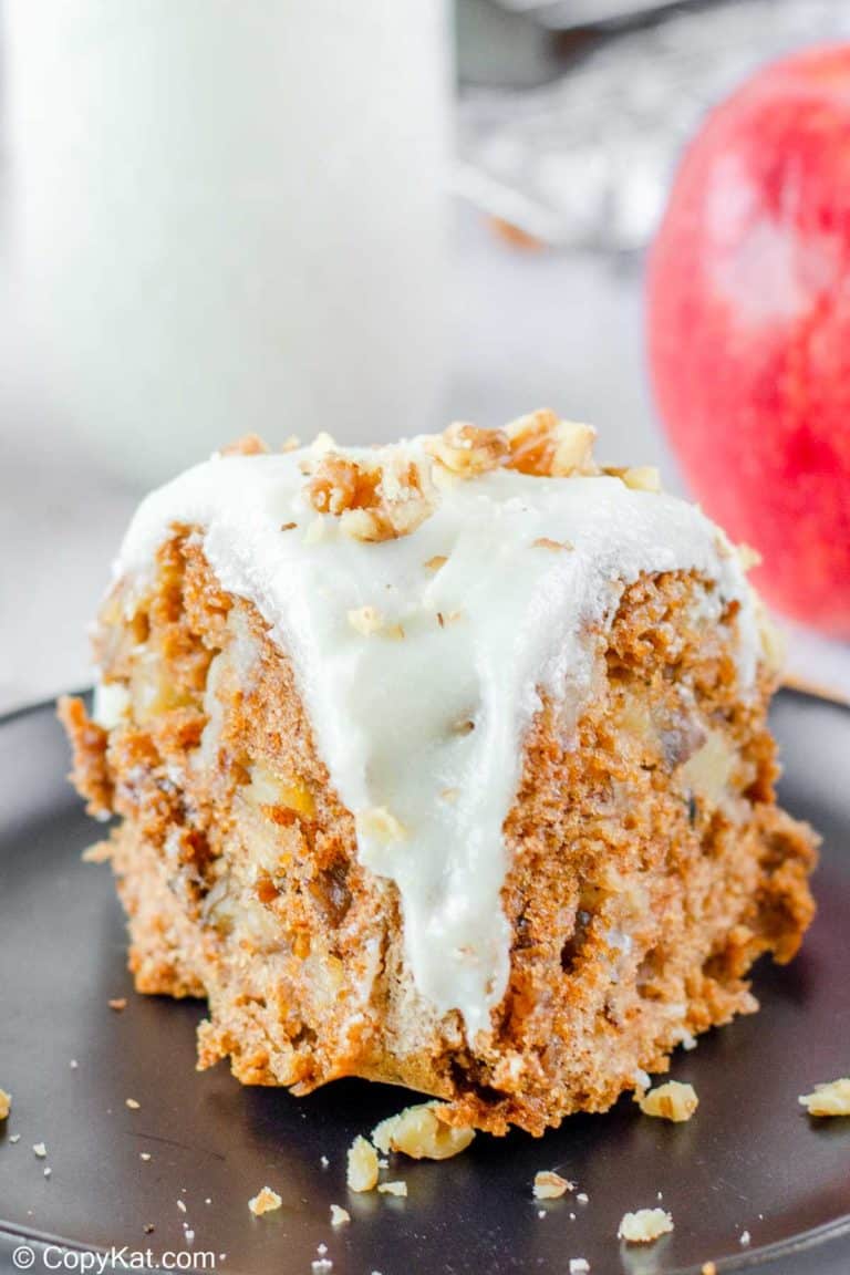 a slice of apple spice bundt cake on a plate.