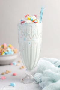 homemade Burger King Lucky Charms milkshake and a blue kitchen towel.