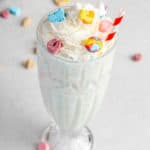 homemade Burger King Lucky Charms milkshake topped with whipped cream and marshmallows.