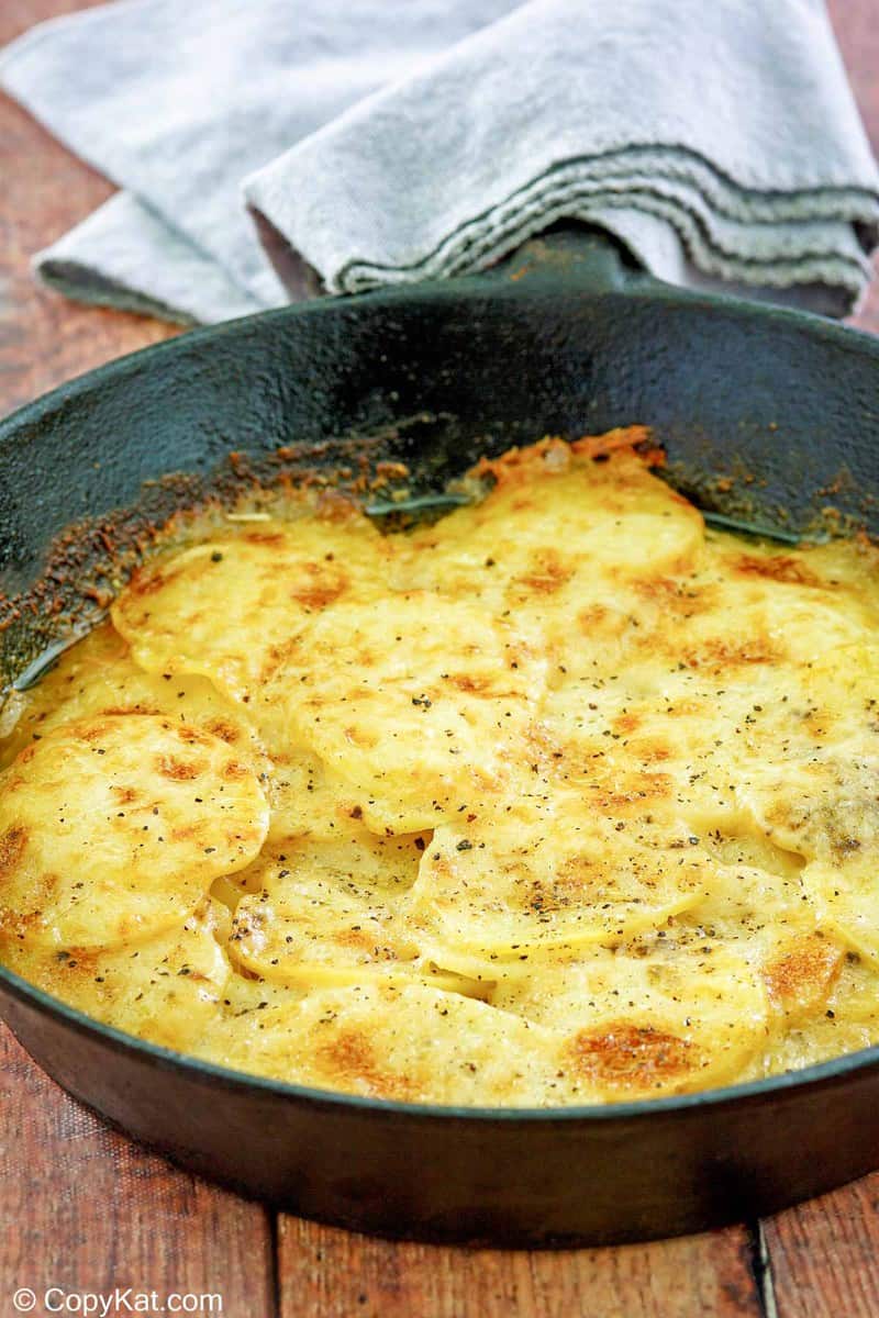 cheesy potatoes au gratin in a skillet.