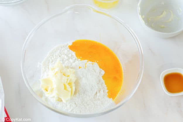 gooey butter cake batter ingredients in a mixing bowl.