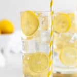 a glass of homemade lemonade garnished with lemon slices.